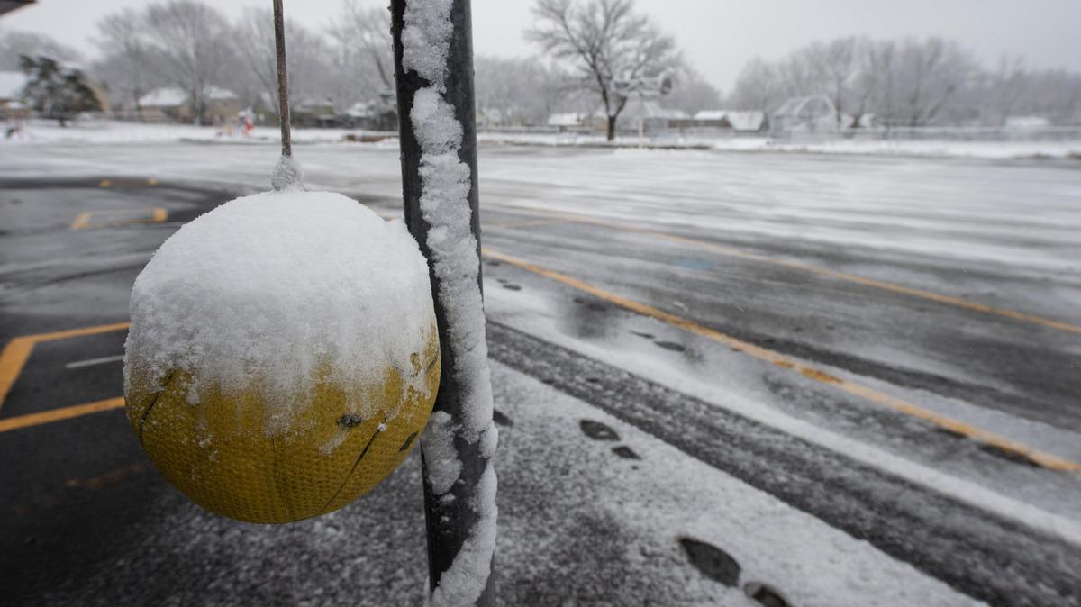 Snow partially covered a tether ball on the playground at Pawnee Elementary School in Overland Park on Friday, January 24, 2020. A majority of school districts in the area were closed due to the snowfall.