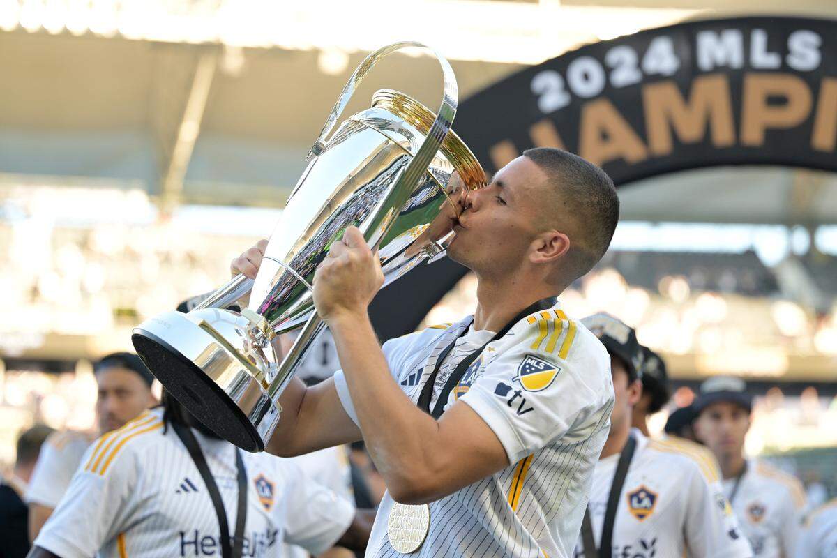 Galaxy forward Dejan Joveljic celebrates with the Philip F. Anschutz trophy after L.A. defeated the New York Red Bulls for the 2024 MLS Cup.