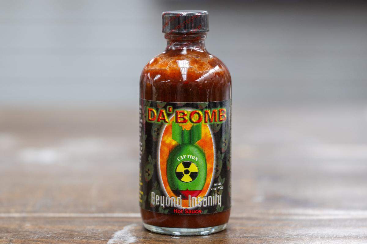 Da' Bomb Beyond Insanity at the Spicin Foods warehouse on Southwest Boulevard, on October 2, 2025, in Kansas City. Measuring at 135,600 SHU on the Scoville heat scale, the sauce was made famous by the YouTube show Hot Ones, where celebrities eat hot wings slathered in hot sauce and attempt to answer questions.