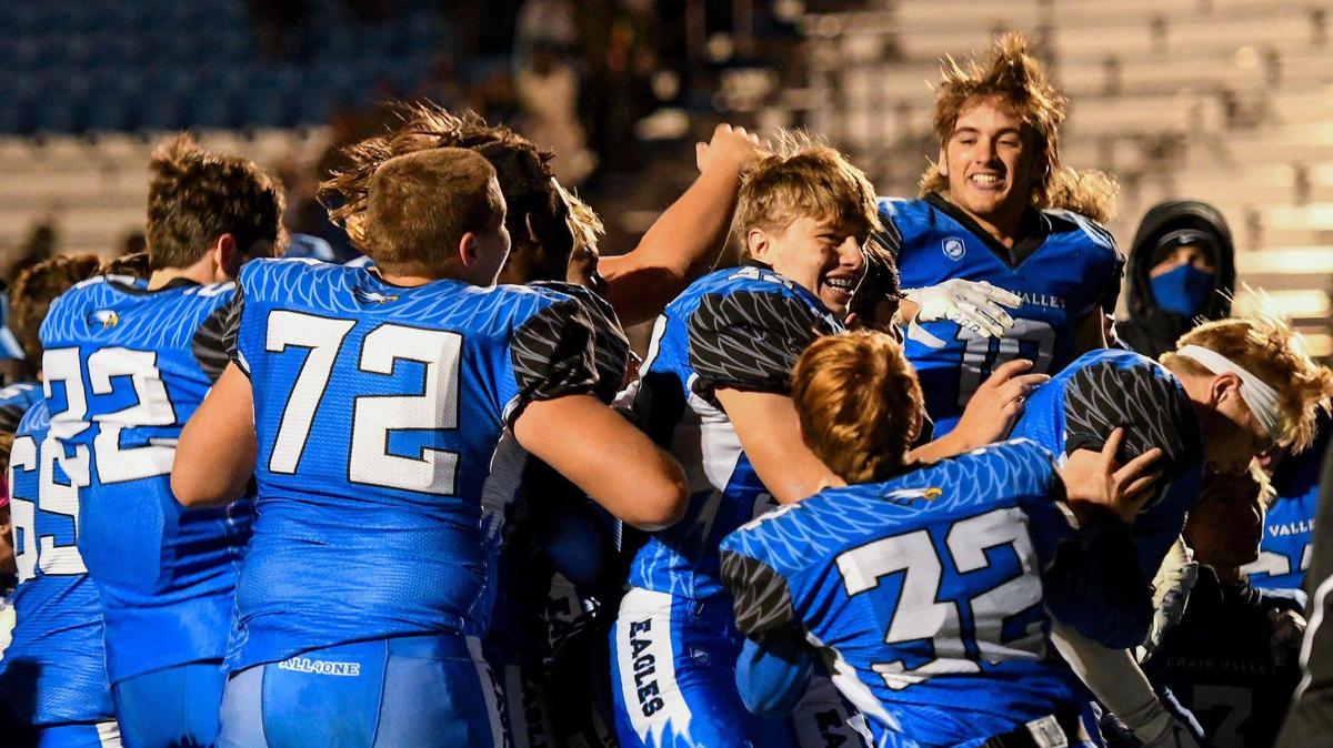 The Grain Valley team celebrates their 22-0 victory over undefeated Belton at Grain Valley on Friday, Oct. 23, 2020. With the win, Grain Valley makes it three-way tie for first with Belton and Raytown in Suburban White Conference.
