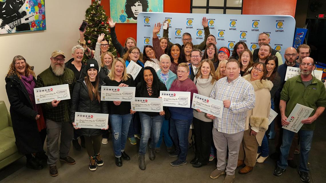 The Heroes to Zeroooos Lottery Club after claiming a $1 million Powerball prize. Each of the Michigan club’s members received about $12,800.