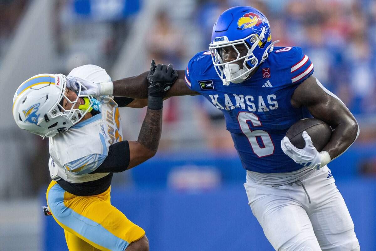 Kansas Jayhawks running back Yasin Willis (6) runs through a tackle in the first half of the Jayhawks game vs. Long Island University Sharks at David Booth Memorial Stadium on Friday, September 4, 2026, in Lawrence.