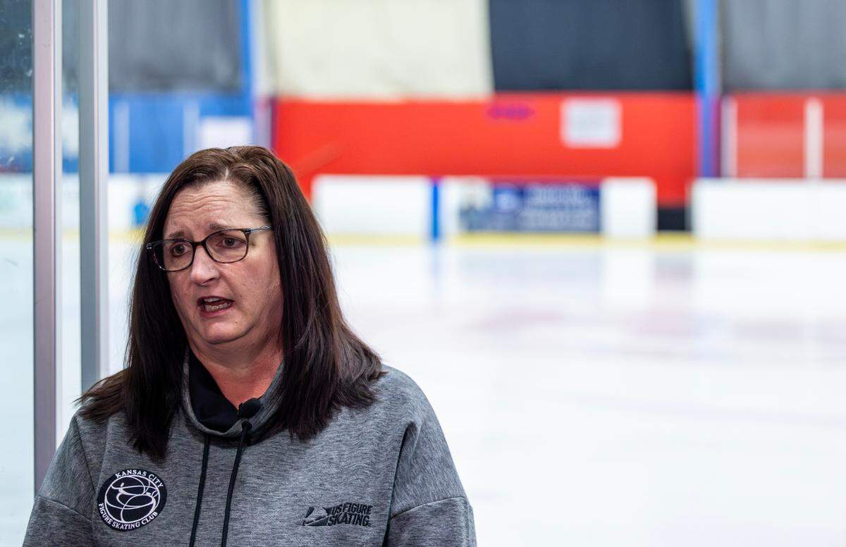 Fran Thornberg, president of the Kansas City Figure Skating Club, speaking at the Kansas City Ice Center, about those in the figure skating community who were killed in a plane crash near Washington D.C.