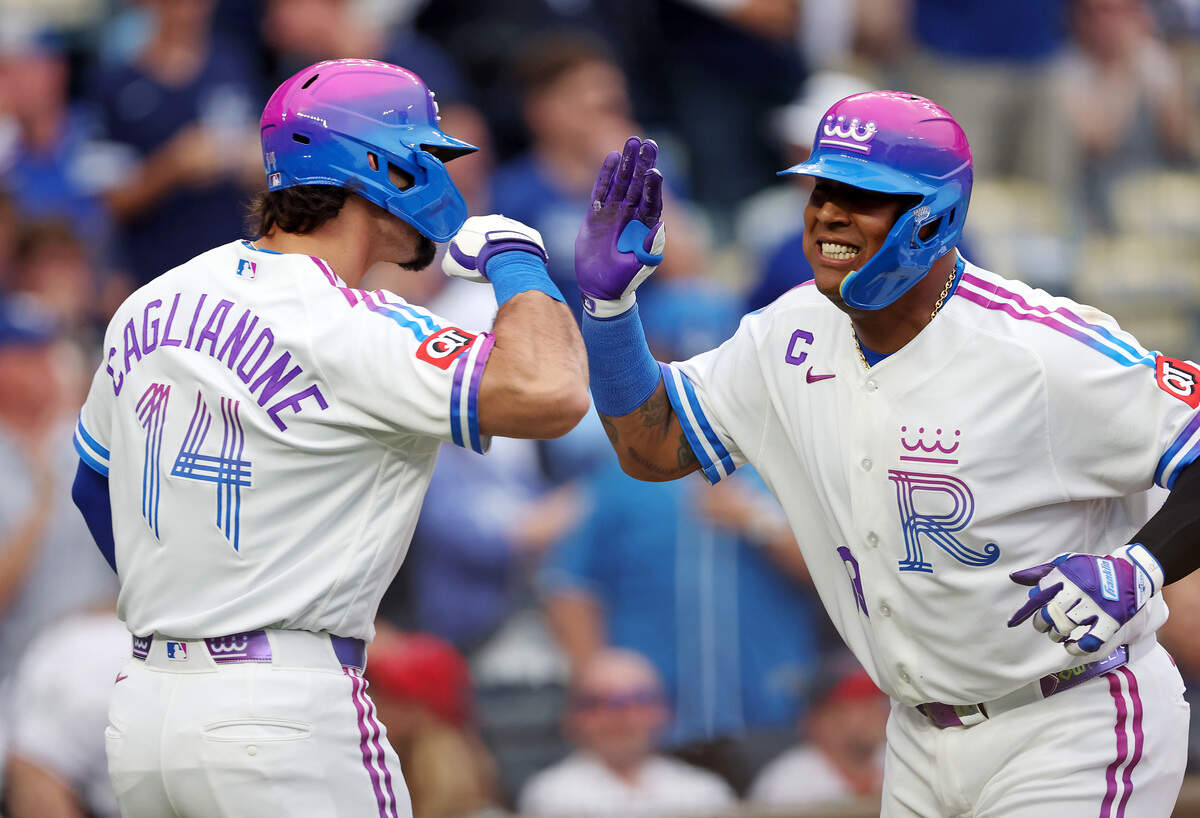 Salvador Perez, right, is congratulated by Royals teammate Jac Caglianone after hitting a home run against the Los Angeles Angels at Kauffman Stadium in Kansas City on Saturday, April 25, 2026.