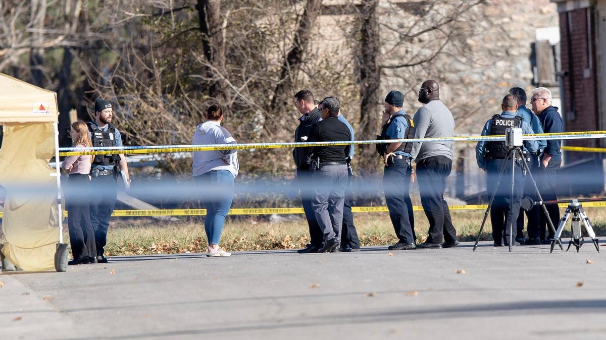 Kansas City police officers and detectives work the scene of a double homicide at the intersection of East 28th Street and Prospect Avenue on Tuesday, Nov. 22, 2022 in Kansas City.