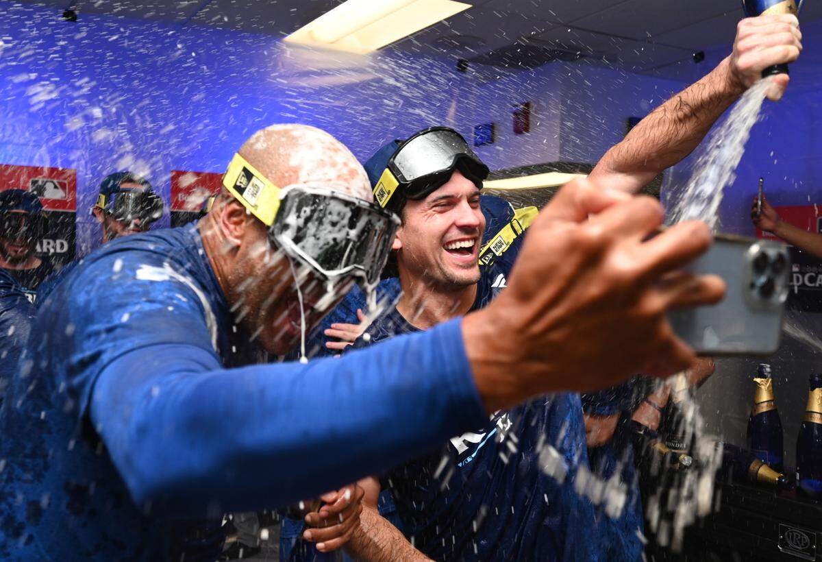 Kansas City Royals players celebrate in the locker room after defeating the Baltimore Orioles in Game 2 of the Wild Card round at Oriole Park at Camden Yards on Oct. 2, 2024.