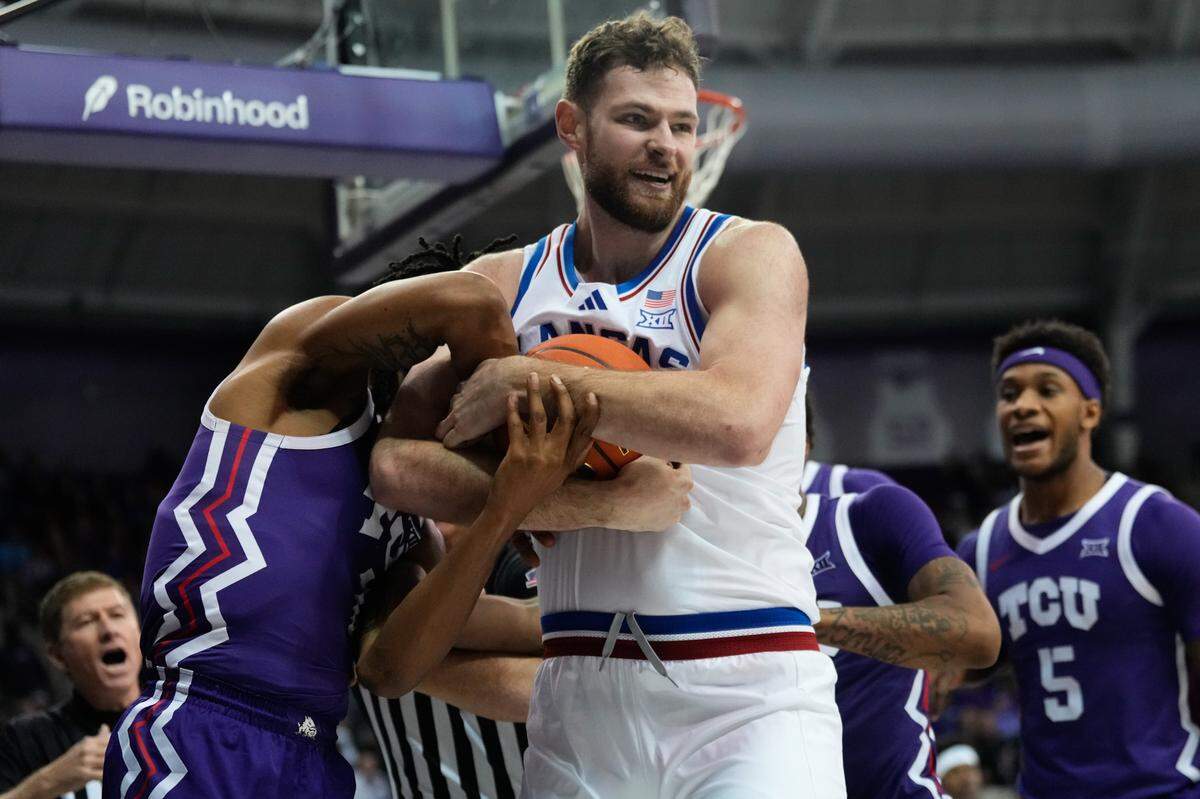 Kansas Jayhawks center Hunter Dickinson (1) battles for possession of the ball against TCU Horned Frogs forward Trazarien White (13) during the second half at Ed and Rae Schollmaier Arena on Jan. 22, 2025.