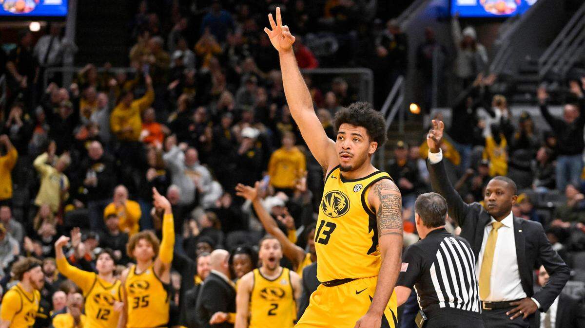Missouri Tigers forward Ronnie DeGray III (13) reacts after making a three pointer against the Illinois Fighting Illini during the first half at Enterprise Center in St. Louis, Missouri, on Dec. 22, 2022.