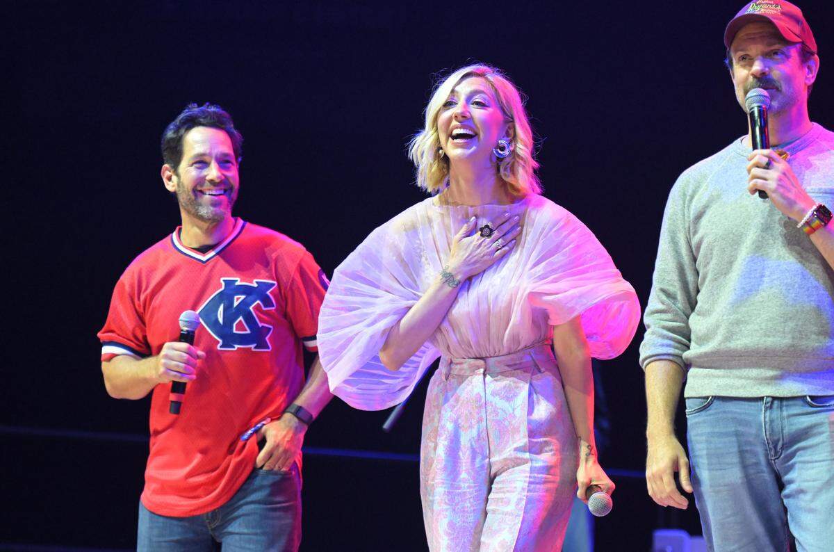 Co-hosts Paul Rudd, left, Heidi Gardner and Jason Sudeikis appear on stage Saturday, May 31, 2025, during the Big Slick Party and Show at T-Mobile Center in Kansas City.