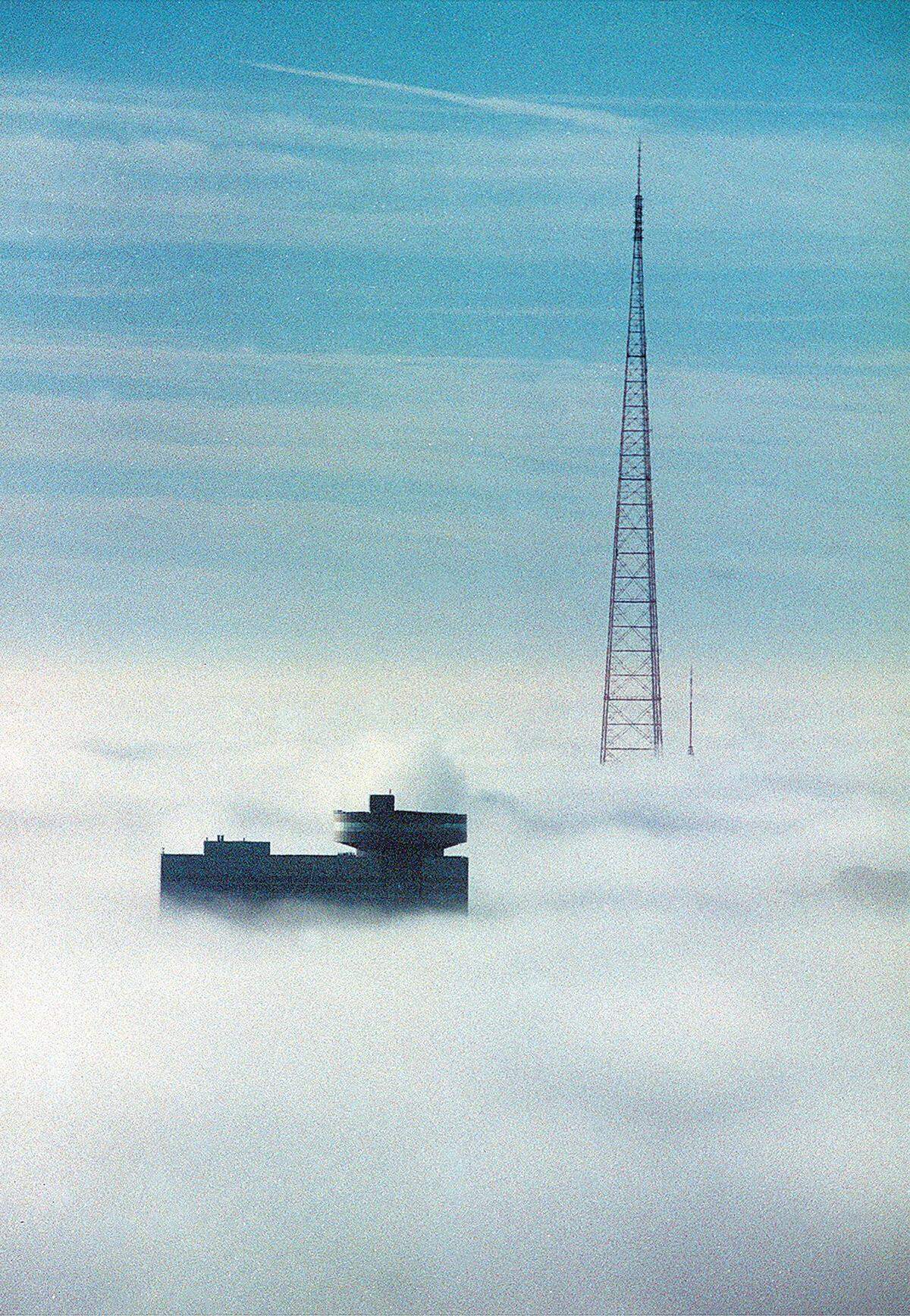The distinctive circular top of the former Hyatt Regency Hotel at Crown Center was above a thick fog that blanketed downtown Kansas City. The circular portion housed Skies restaurant.