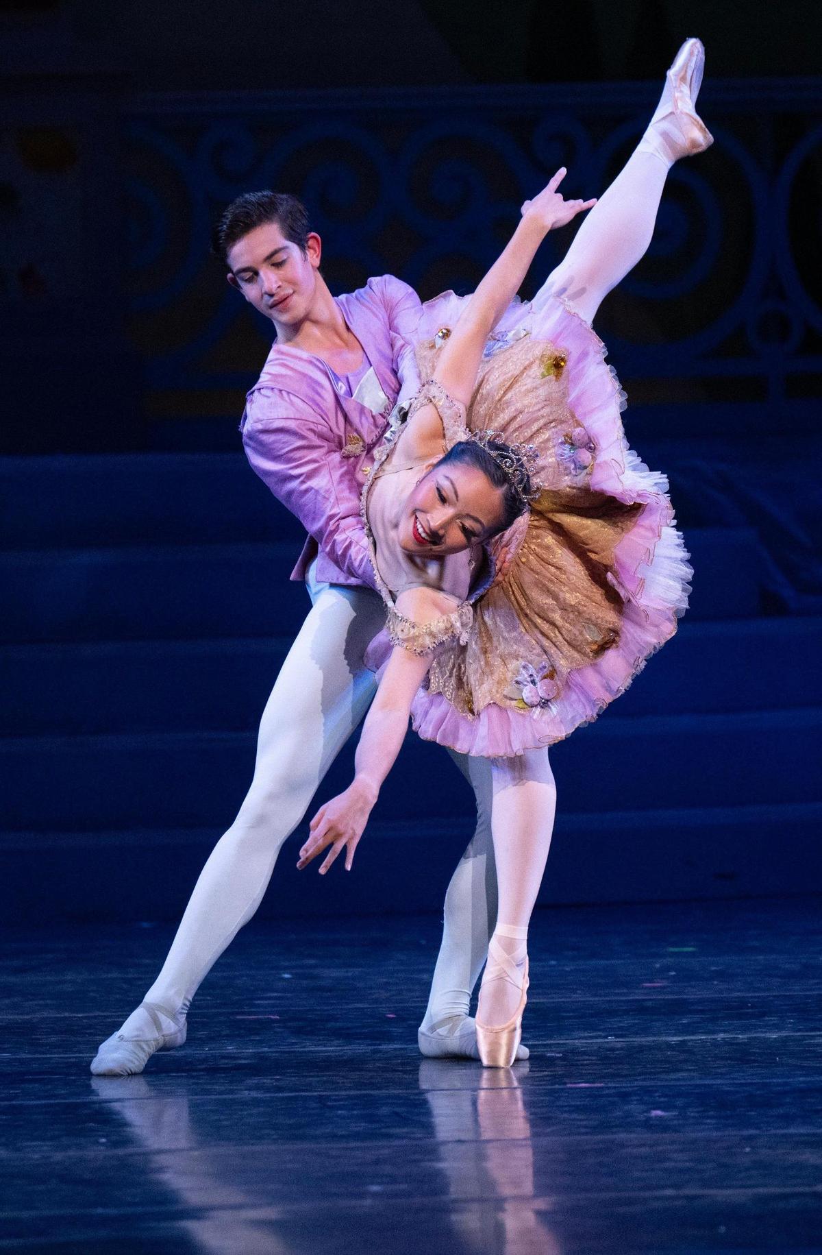 The Sugar Plum Fairy and Her Cavalier, Naomi Tanioka and Joshua Kiesel, dance in the final dress rehearsal of “The Nutcracker.” The tutu Tanioka wears is a $10,000 costume piece made with fabric that costs $100 per yard.