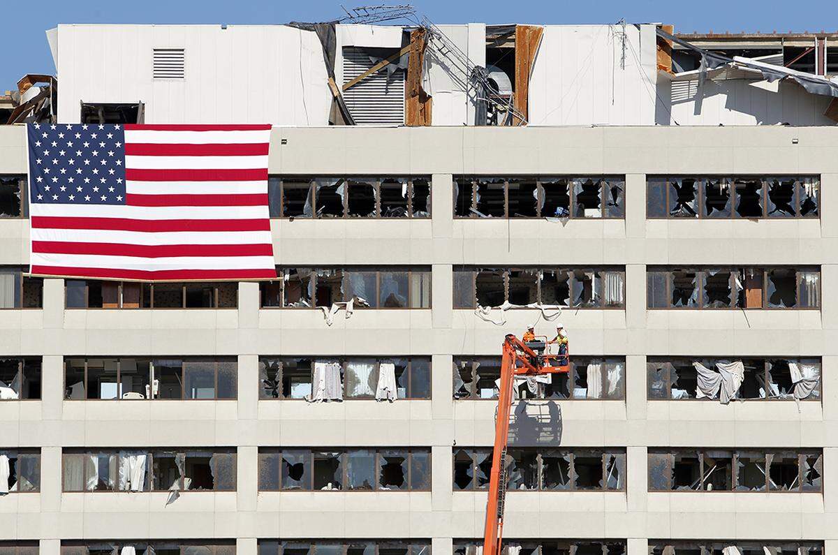 Workers surveyed the tornado-damaged St. John's Regional Medical Center on June 15, 2011.