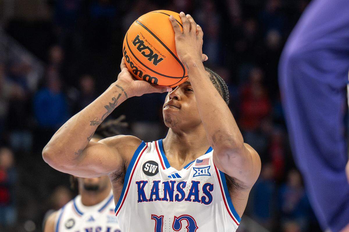 Kansas Jayhawks guard Elmarko Jackson (13) makes a free throw shot during the second half of a Big 12 Men's Basketball Tournament game against the Texas Christian University Horned Frogs at T-Mobile Center on Thursday, March 12, 2026, in Kansas City.