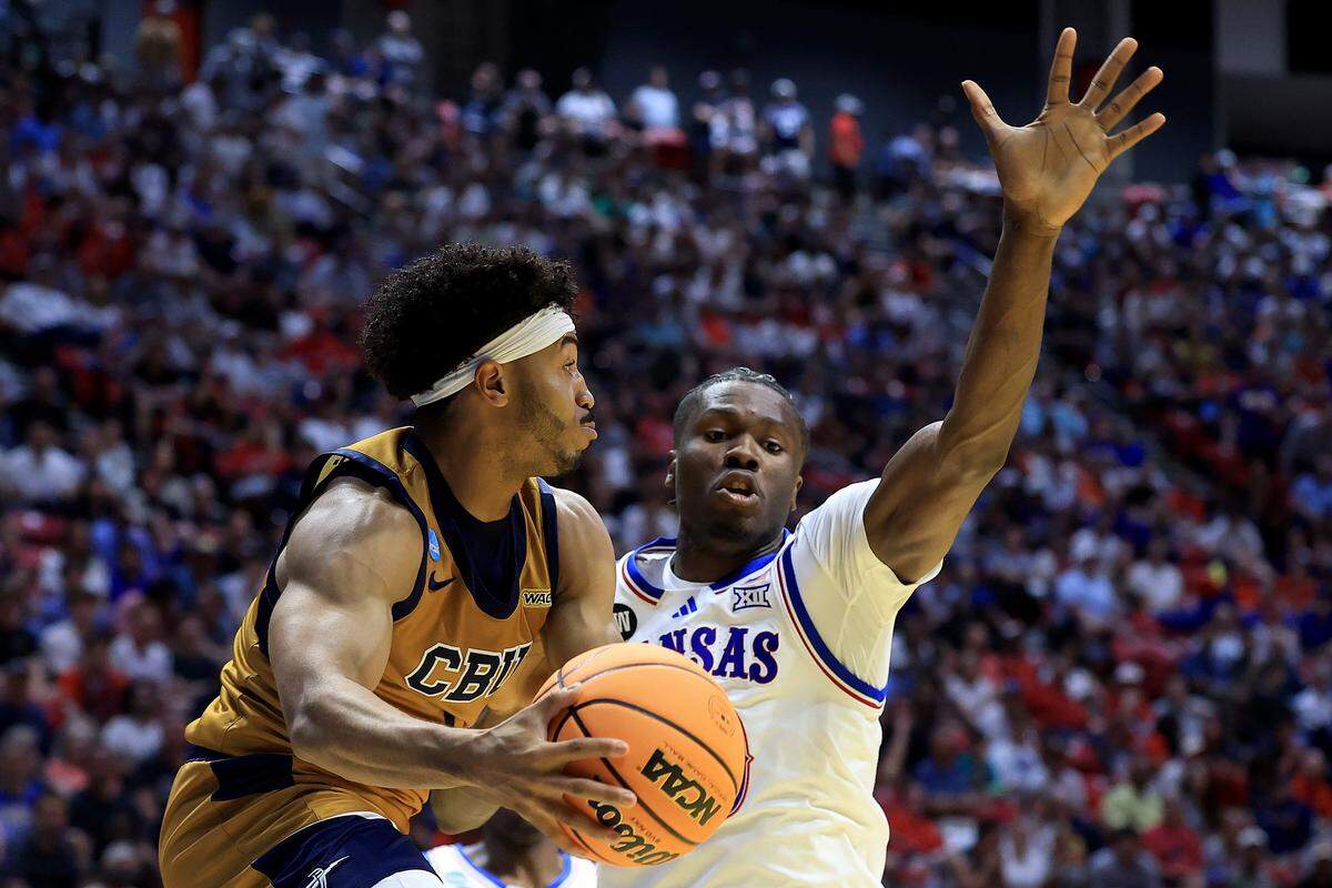 Dominique Daniels Jr. #1 of the California Baptist Lancers looks to pass during the first half of the game against the Kansas Jayhawks in the first round of the 2026 NCAA Men's Basketball Tournament at Viejas Arena at San Diego State University on March 20, 2026 in San Diego.