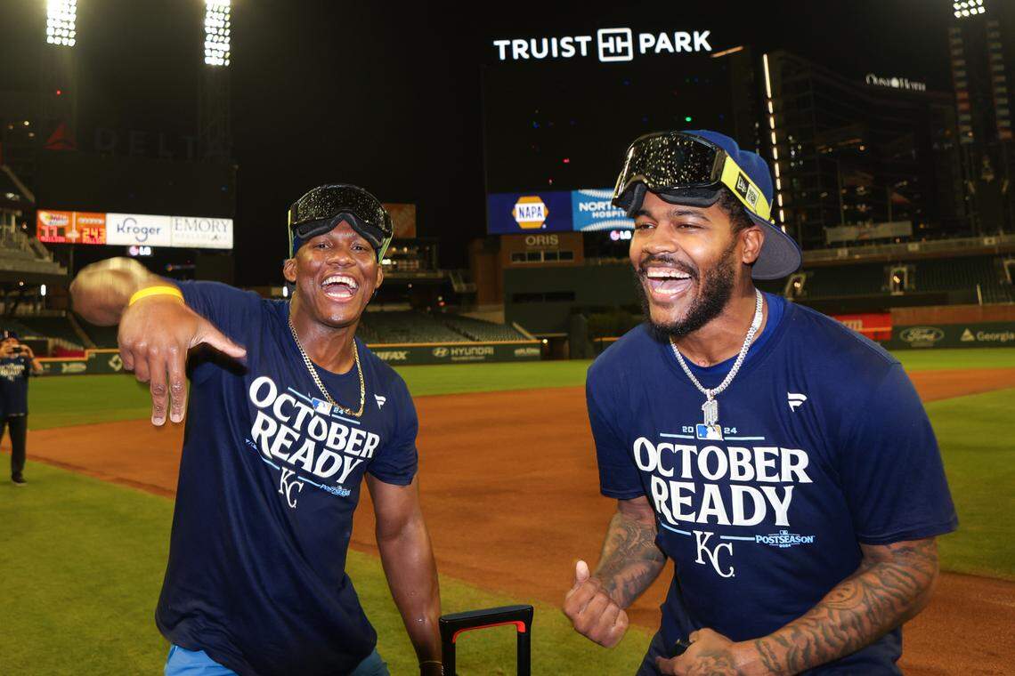 Kansas City Royals outfielder Dairon Blanco (44) and third baseman Maikel Garcia (11) celebrates after clinching a wild card playoff birth after a game against the Atlanta Braves at Truist Park.