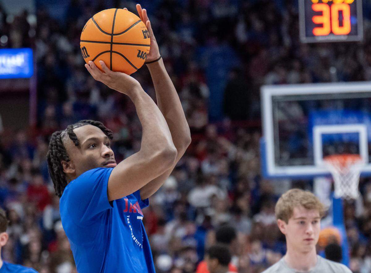 Kansas Jayhawks guard Darryn Peterson (22) warms up before the game against the Cincinnati Bearcats at Allen Fieldhouse on Saturday, Feb. 21, 2026, in Lawrence, Kansas.