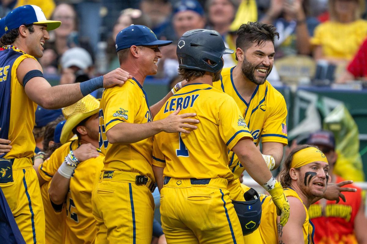 Former Kansas City Royals first baseman Eric Hosmer surprises fans during a dance routine with Savannah Bananas players during a Banana Ball game against the Firefighters at Kauffman Stadium on Friday, May 23, 2025, in Kansas City.