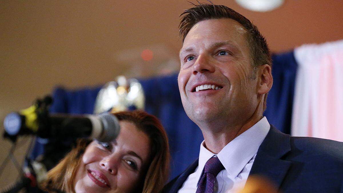 Kansas Republican gubernatorial candidate Kris Kobach and his wife Heather