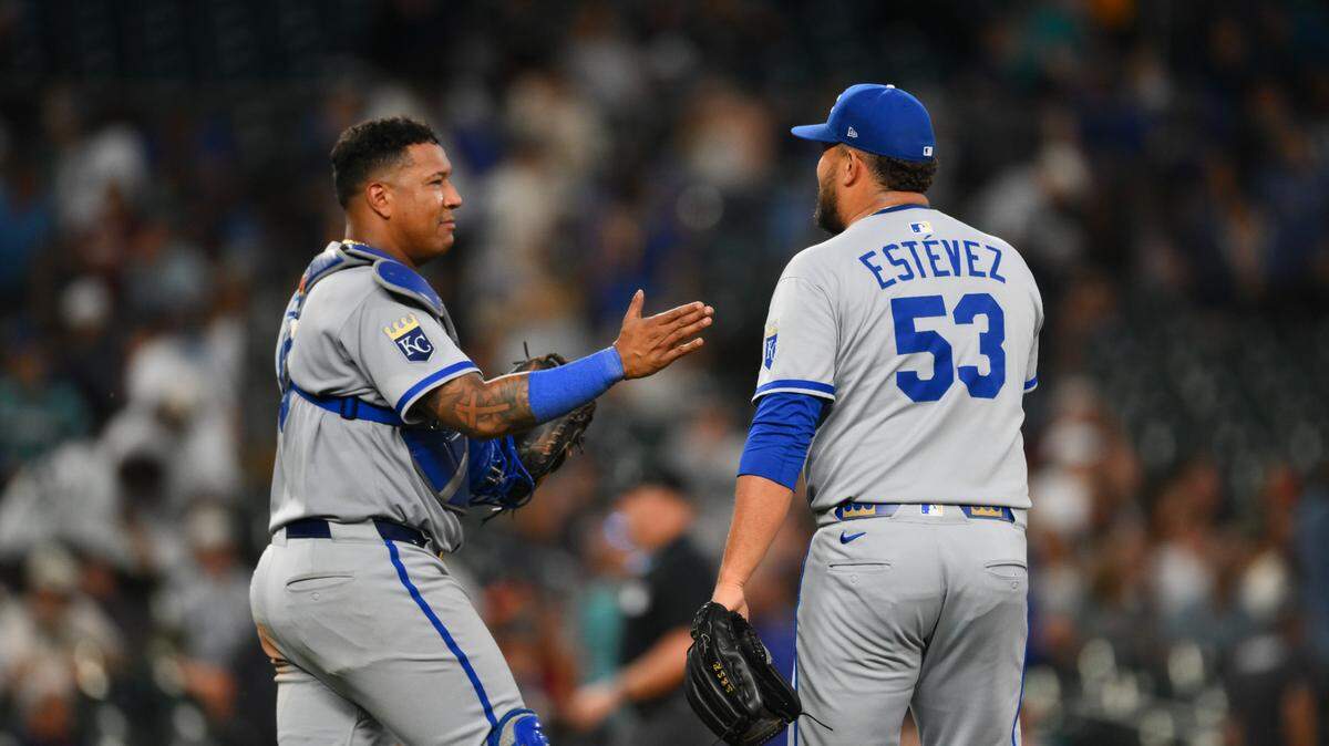 Kansas City Royals catcher Salvador Perez (13) and relief pitcher Carlos Estevez (53) celebrate after defeating the Seattle Mariners at T-Mobile Park on July 1, 2025.