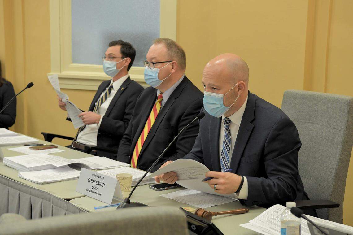 Missouri Rep. Cody Smith (right), a Carthage Republican, chairs a House Budget Committee meeting on March 22, 2021 with staff member Chris Dunn (center) and vice-chair Dirk Deaton, a Noel Republican.