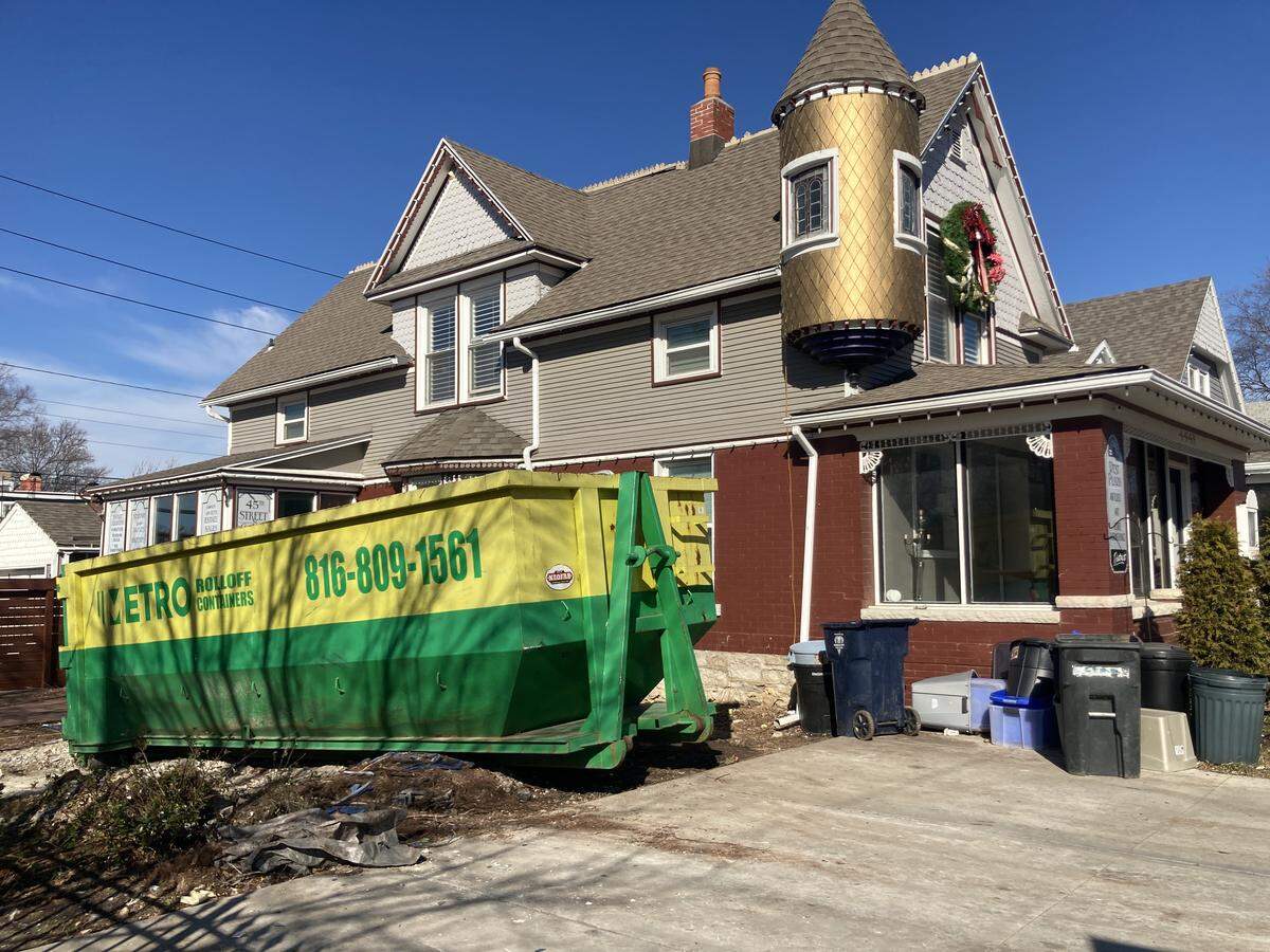 Dumpster outside of antique business, 4448 Bell St. One of several properties along “antiques row” on West. 45th Street being sold following the death of owner Melvin Dwain Smith, 83, on Dec. 10
