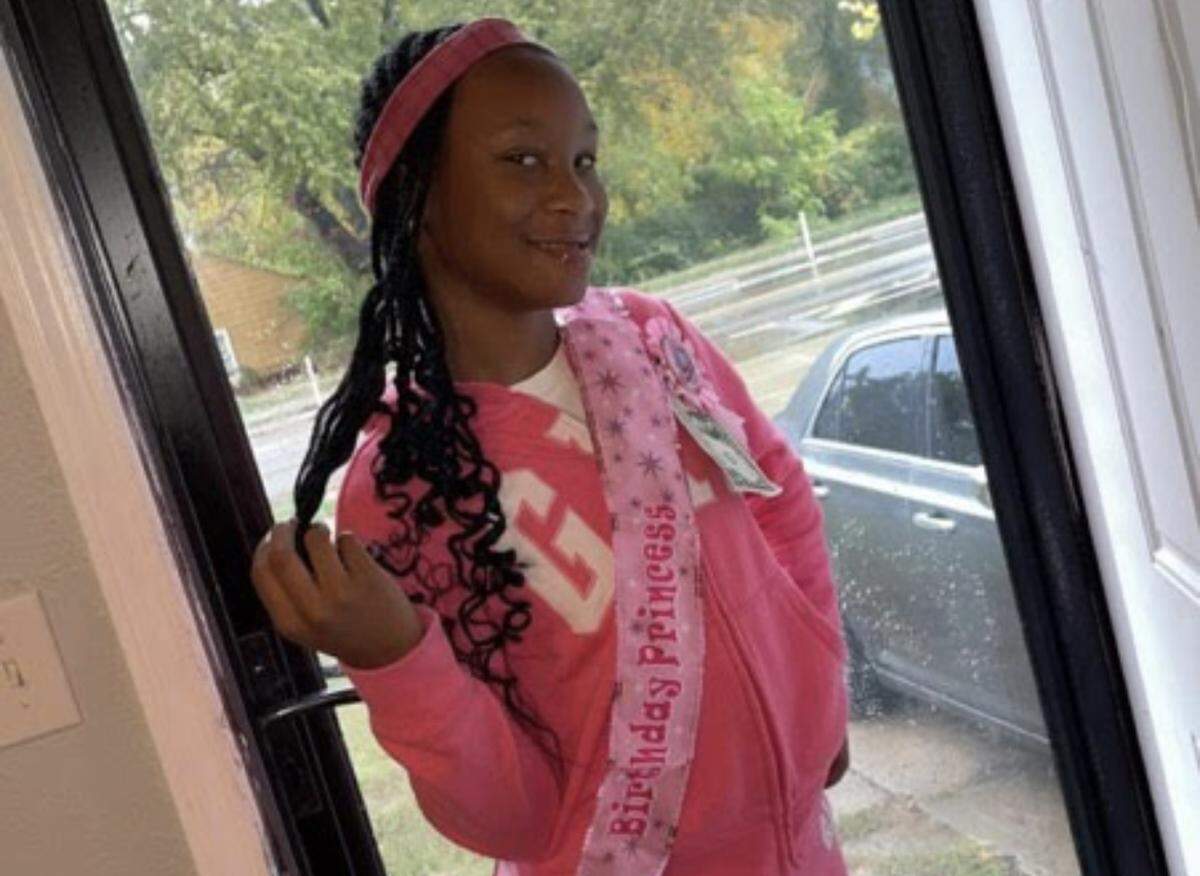 Lauren Reddick, 11, wears a sash celebrating her birthday