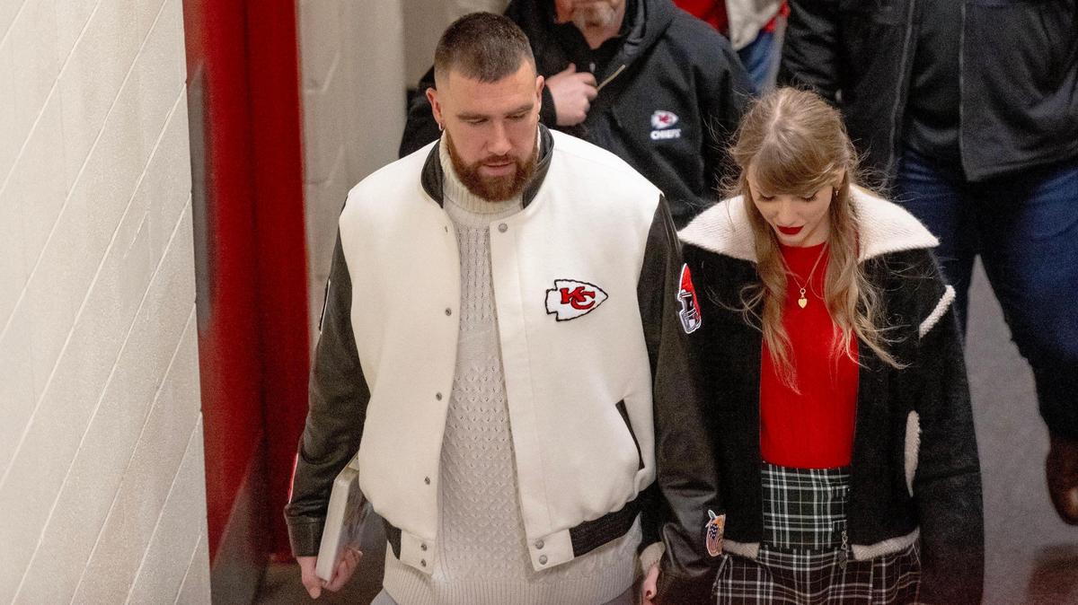 Pop star Taylor Swift holds hands with boyfriend and Kansas City Chiefs tight end Travis Kelce as they leave Arrowhead Stadium on Christmas Day, 2023.