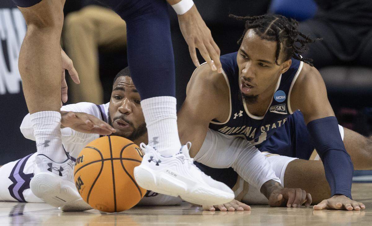 Kansas State’s Desi Sills scrambles after a loose ball against Montana State’s Robert Ford III during the first half of their first round NCAA Tournament game in Greensboro, NC on Friday night.