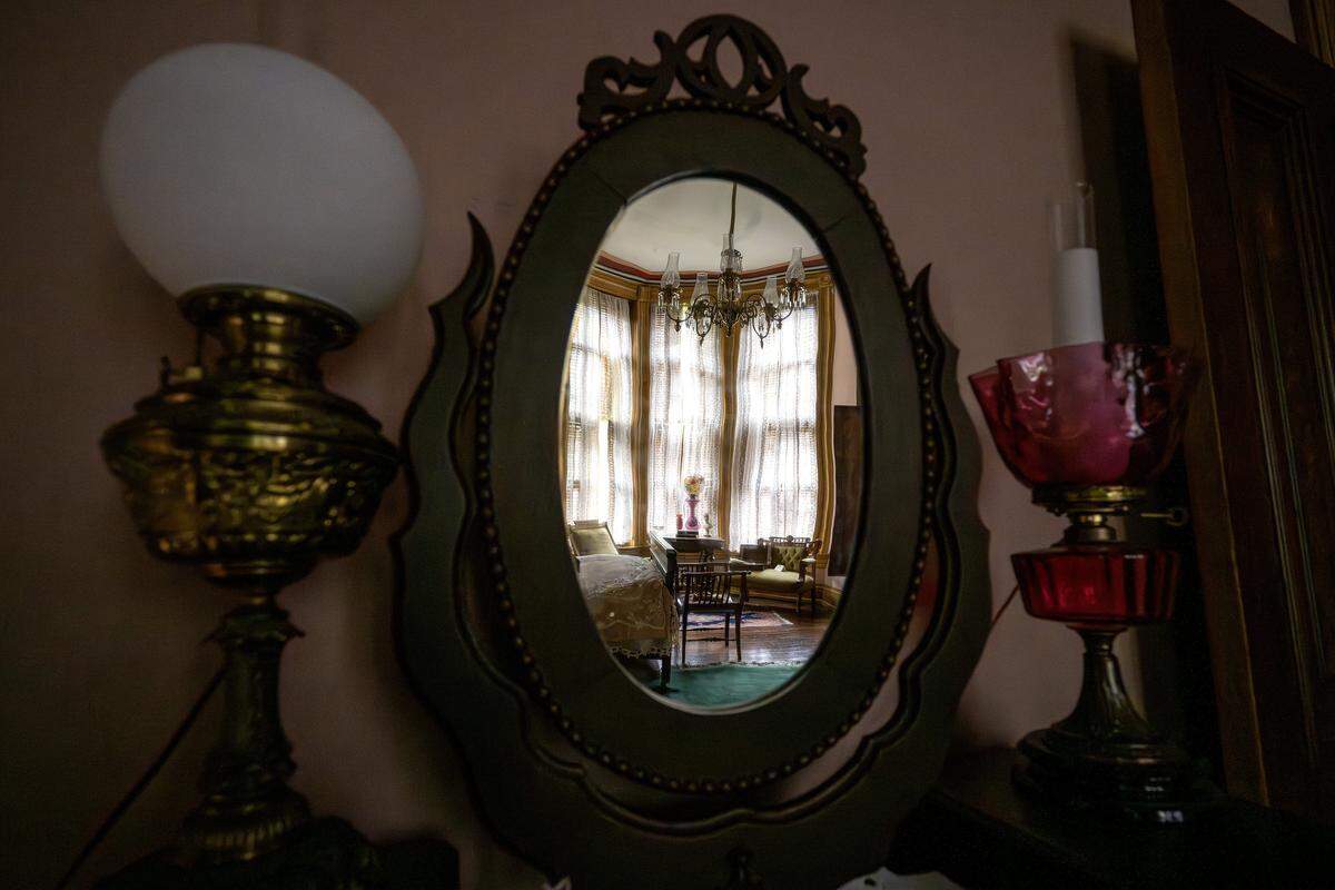 The reflection of an upstairs bedroom is seen in a mirror at the Vaile Mansion on Tuesday, May 5, 2026, in Independence