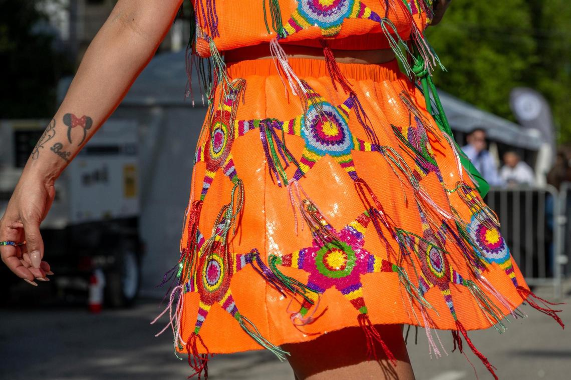 Alyssa Vincent showcases her sequined piñata-themed skirt and top during the Cinco de Mayo Festival at the Guadalupe Centers.