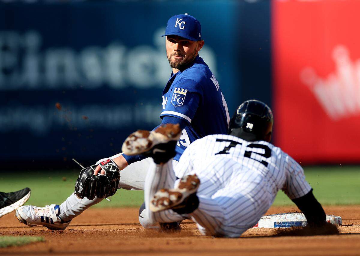 José Caballero #72 of the New York Yankees tags up and slides safely into second base as Michael Massey #19 of the Kansas City Royals is late with the tag during their game at Yankee Stadium on April 19, 2026 in New York City.
