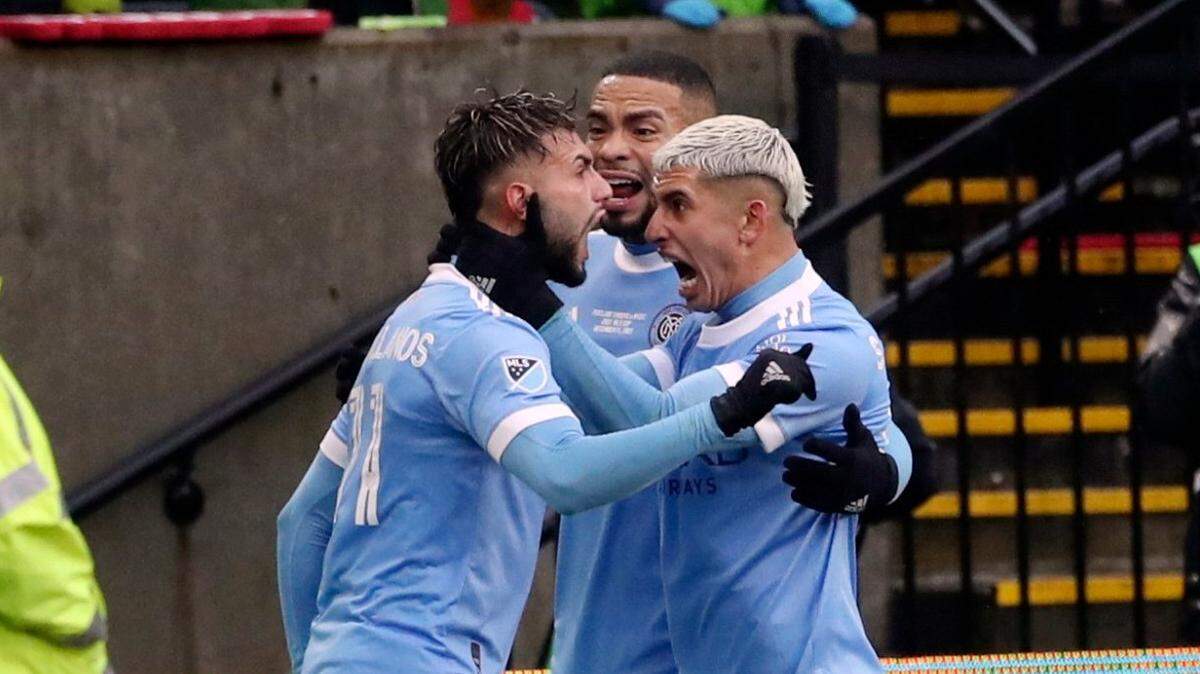New York City FC forward Valentin Castellanos (11) celebrates with teammates after scoring a goal during the first half of the MLS Cup Final in Portland, Ore.