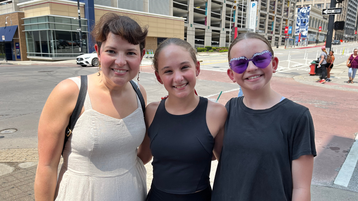Jondelyn Catlette brought her 12-year-old daughter, Iris Catlette, far right, and friend Clark Brimm all the way from Oxford, Mississippi, to see the Olivia Rodrigo concert at T-Mobile Center in Kansas City on Friday, July 26.
