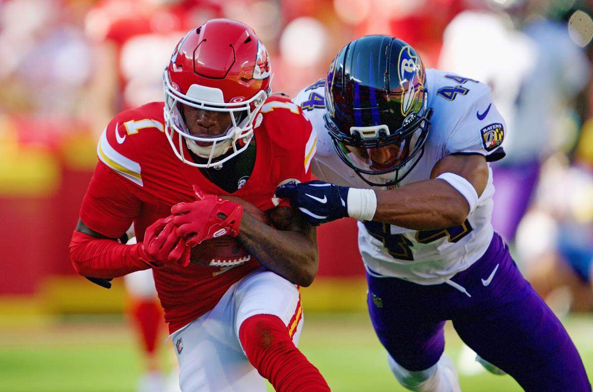 Baltimore Ravens cornerback Marlon Humphrey (44) grabs Kansas City Chiefs wide receiver Xavier Worthy (1) after Worthy made a catch for a first down in the second quarter on Sunday, Sept. 28, 2025, at GEHA Field at Arrowhead Stadium.