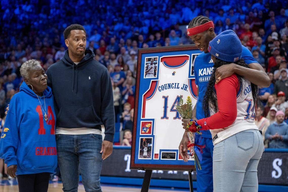 With family at his side, Kansas Jayhawks guard Melvin Council Jr. (14), a senior, is honored on Senior Day after the KU-KSU game on Saturday, March 7, 2026, at Allen Fieldhouse in Lawrence.