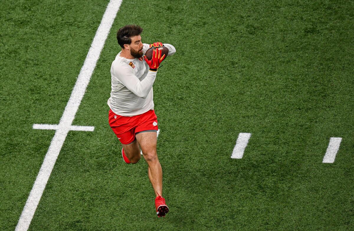 Travis Kelce warms up on the field before Super Bowl LIX on Sunday, Feb. 9, 2025, in New Orleans.