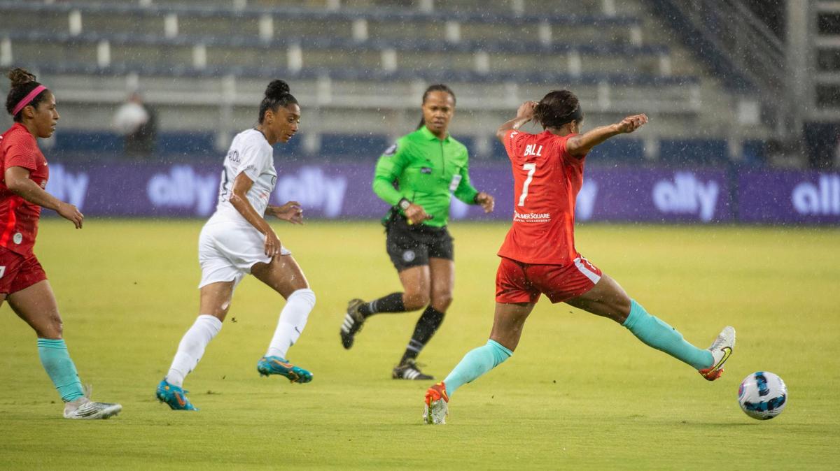 Kansas City Current defender Elizabeth Ball, right, passes the ball to a teammate during the first half of an NWSL Challenge Cup semifinal match at Children’s Mercy Park in Kansas City, Kan.