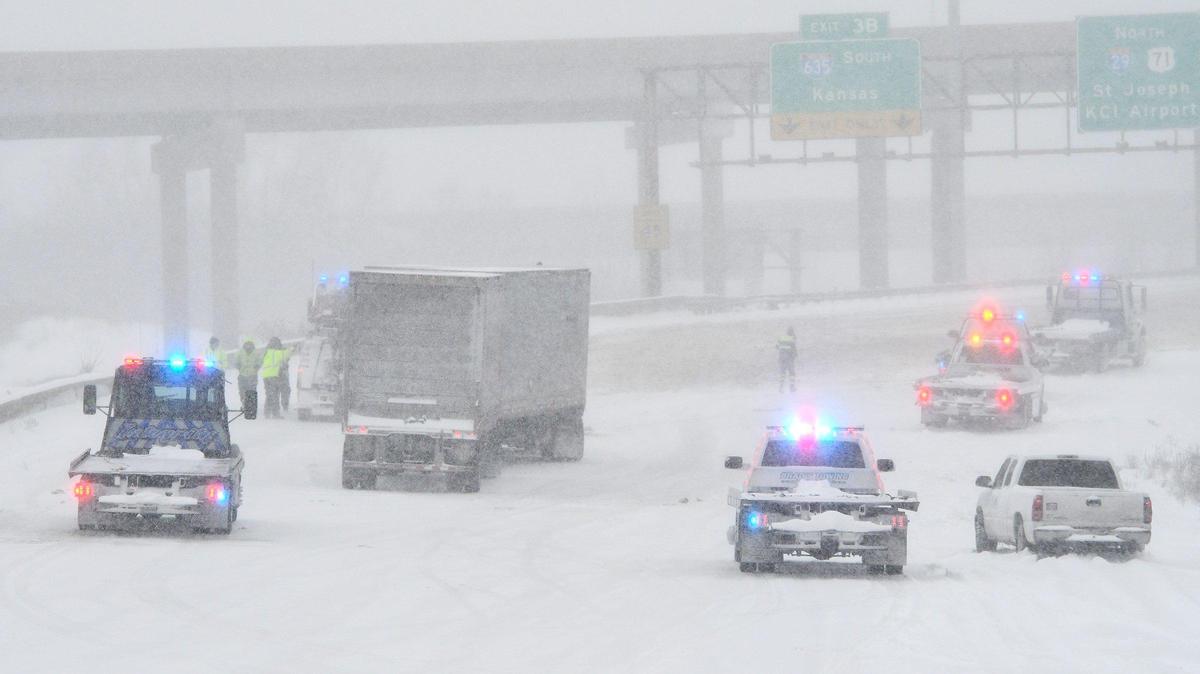 Northbound Interstate 29 near Waukomis Drive in the Northland remains closed as emergency crews work the scene Thursday morning, Feb. 17, 2022, causing a backup. A storm brought several inches of snow to the Kansas City area.