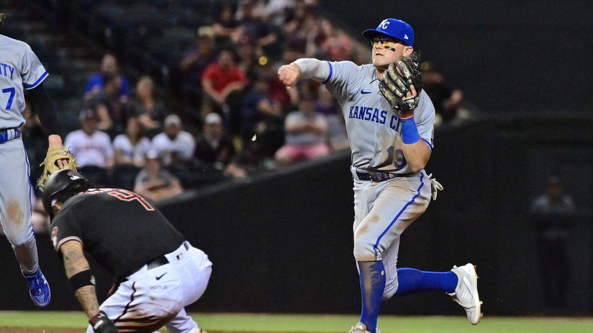 Kansas City Royals second baseman Michael Massey (19) turns a double play on Arizona Diamondbacks second baseman Ketel Marte (4) in the seventh inning at Chase Field in Phoenix on April 24, 2023.