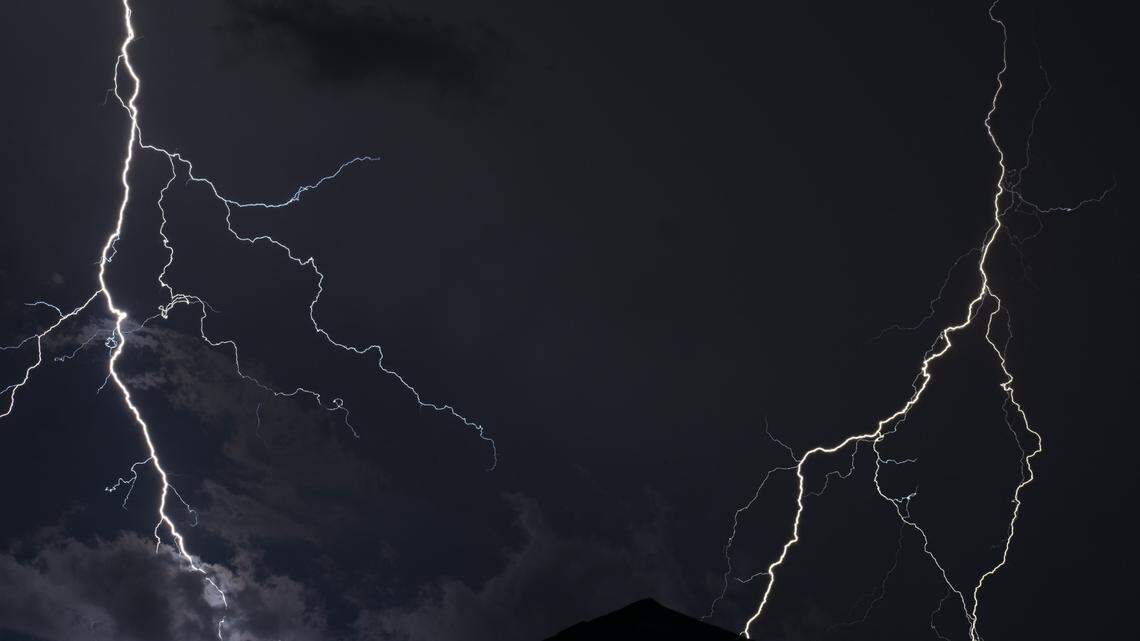 A woman stopped to buy a Powerball ticket after seeing two strikes of lightning hit close by.