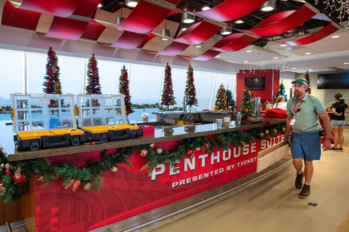Crews set up a scene inside Arrowhead in July, stringing Christmas lights and decorating faux Christmas trees.
