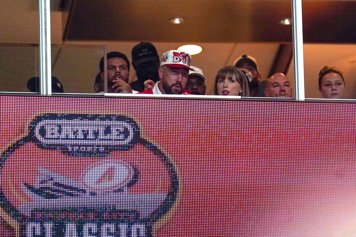 Kansas City Chiefs tight end Travis Kelce, left, and singer-songwriter Taylor Swift appear at the Kansas City Classic season opening game between the Cincinnati Bearcats and Nebraska Cornhuskers, Aug. 28, 2025, at Arrowhead Stadium. This is the first time the couple have appeared in the public since their engagement.