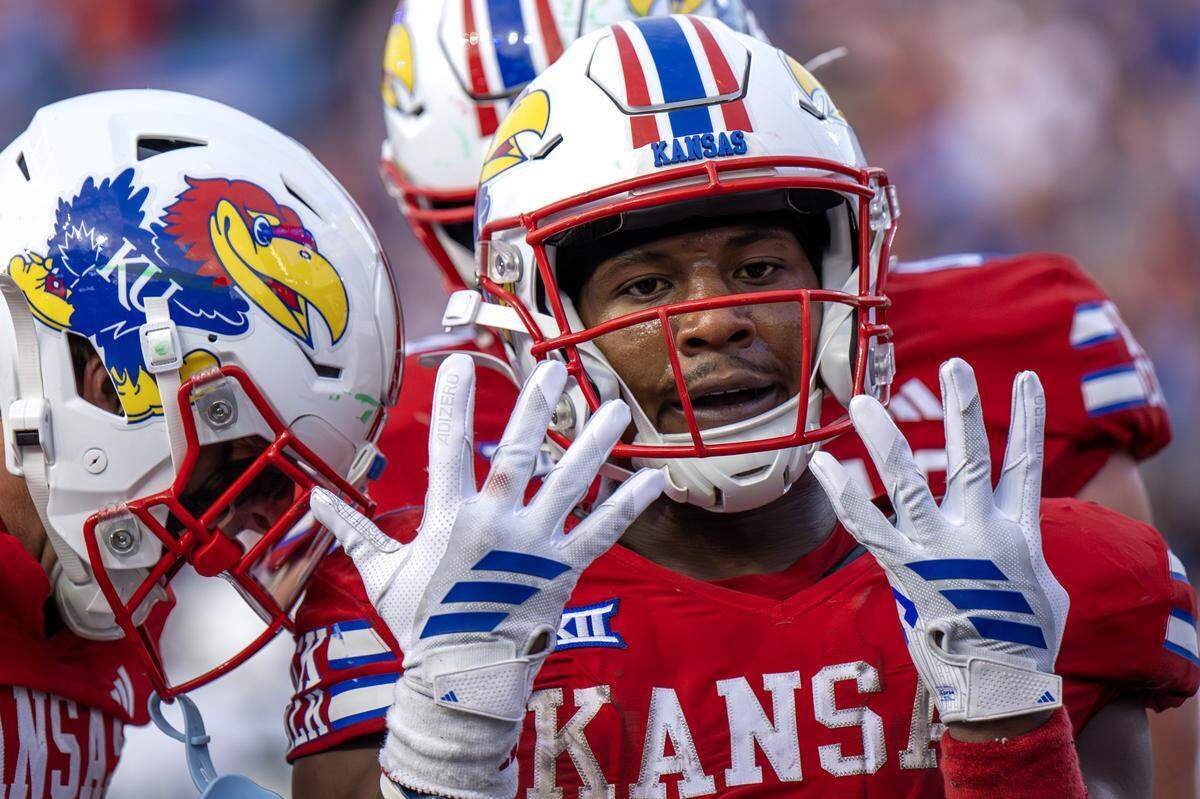 Kansas Jayhawks running back Daniel Hishaw Jr. (9) celebrates a touchdown during the second quarter of a game against Wagner at David Booth Kansas Memorial Stadium on Friday, Aug. 29, 2025, in Lawrence.