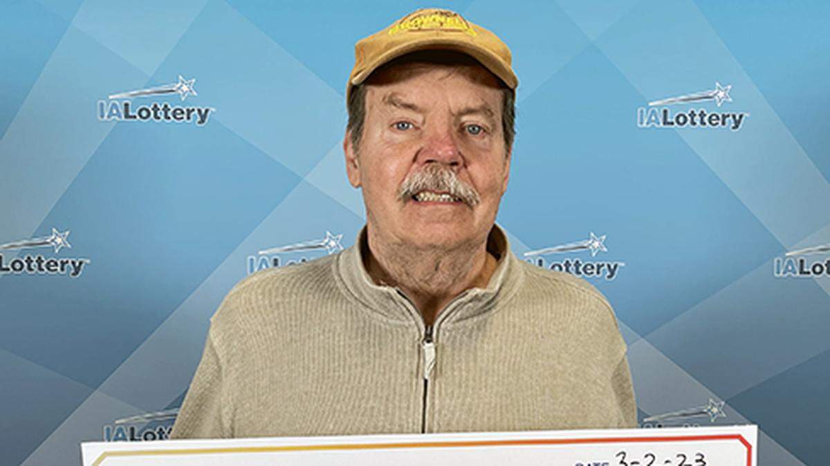 Michael Mettler with his oversized check.