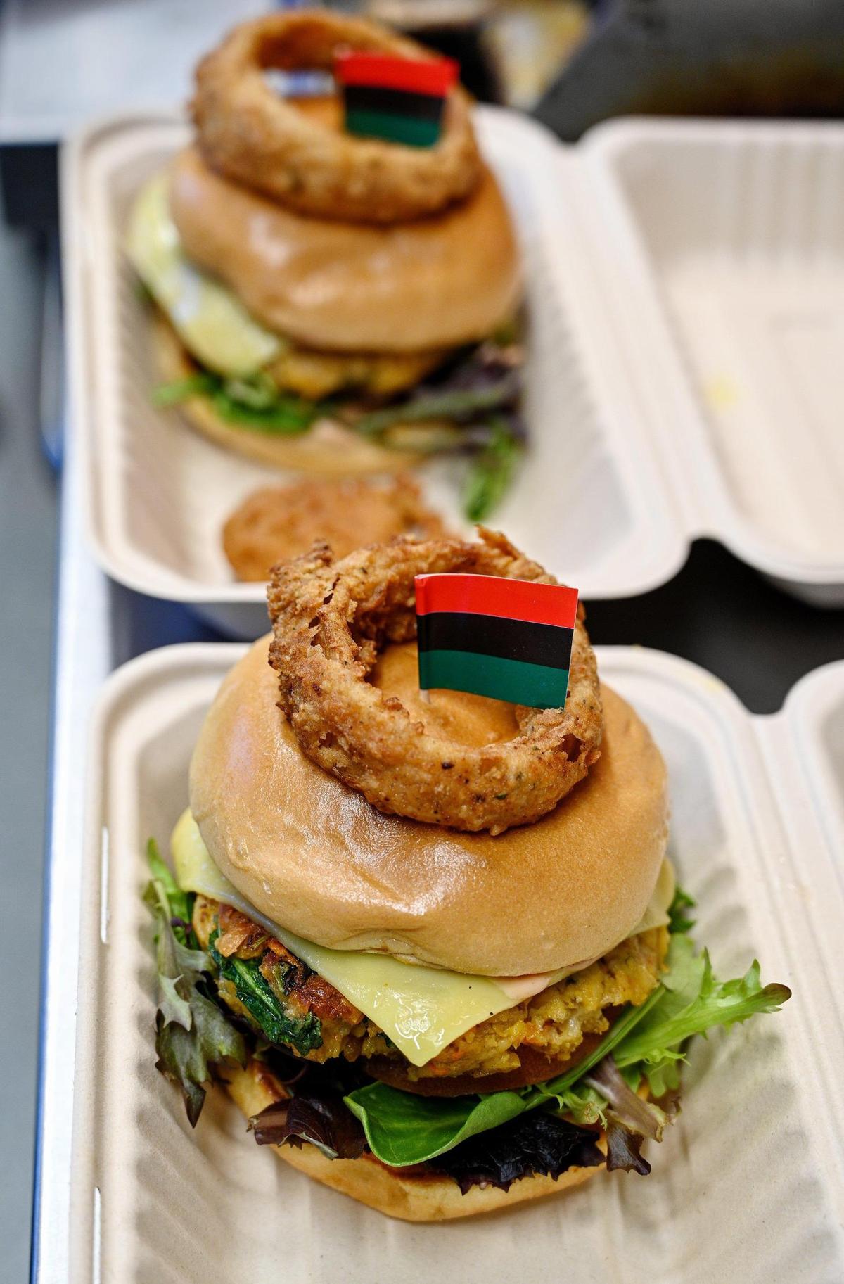 Vegan Crave’s District Burger, a top seller, is made of chickpeas and kale with smoked Gouda cheese and topped with a seasoned onion ring. For Black History Month, owner Teeshia Madge adds a little Pan-African flag.