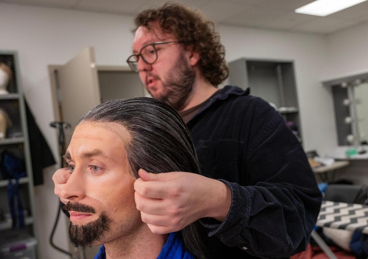 Blaine Shepherd, right, works on the hair of dancer Gavin Abercrombie, who was being costumed for his role as Dr. Drosselmeier in the Kansas City Ballet’s production of “The Nutcracker.”