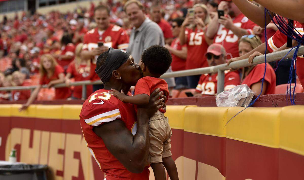 Kansas City Chiefs wide receiver Byron Pringle kisses his baby before the start of Saturday’s preseason game, Aug. 24, 2019, at Arrowhead Stadium.