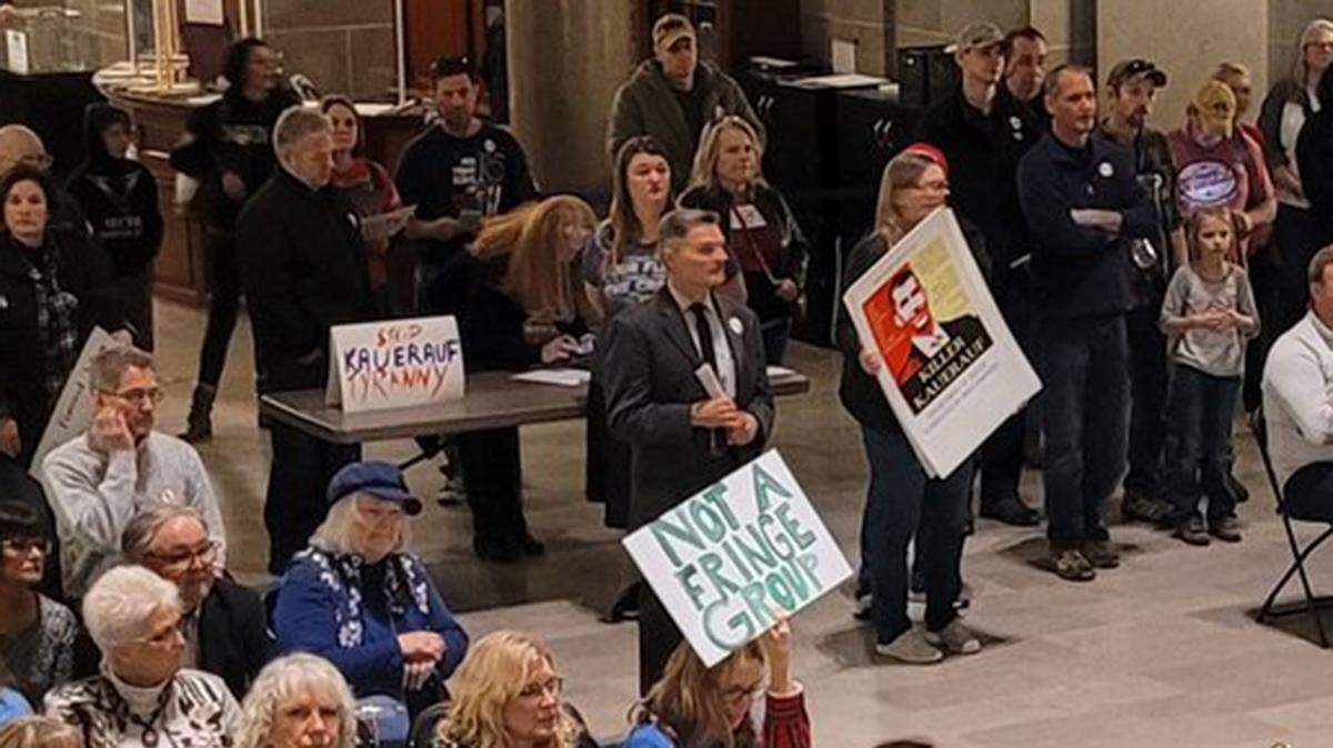 Opponents of Donald Kauerauf’s nomination held signs denouncing him as a “killer” who would bring “tyranny” to Missouri’s health department.