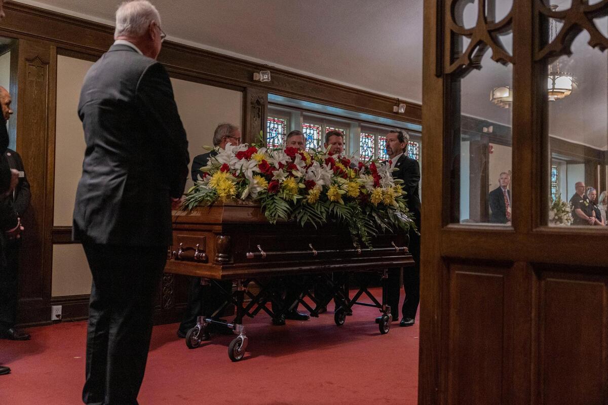 Flowers are put on Len Dawson’s casket as it was wheeled in through the back of the sanctuary at Country Club Christian Church for a memorial service on Friday, Sep. 16, 2022, in Kansas City.