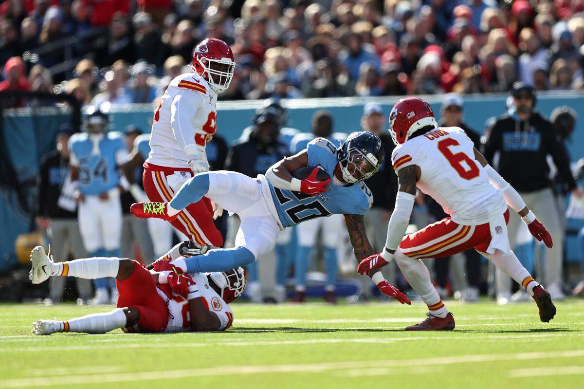 Tennessee Titans running back Tony Pollard carries the ball against the Kansas City Chiefs during an NFL Week 16 game at Nissan Stadium in Nashville, Tennessee on Sunday, Dec. 21, 2025.